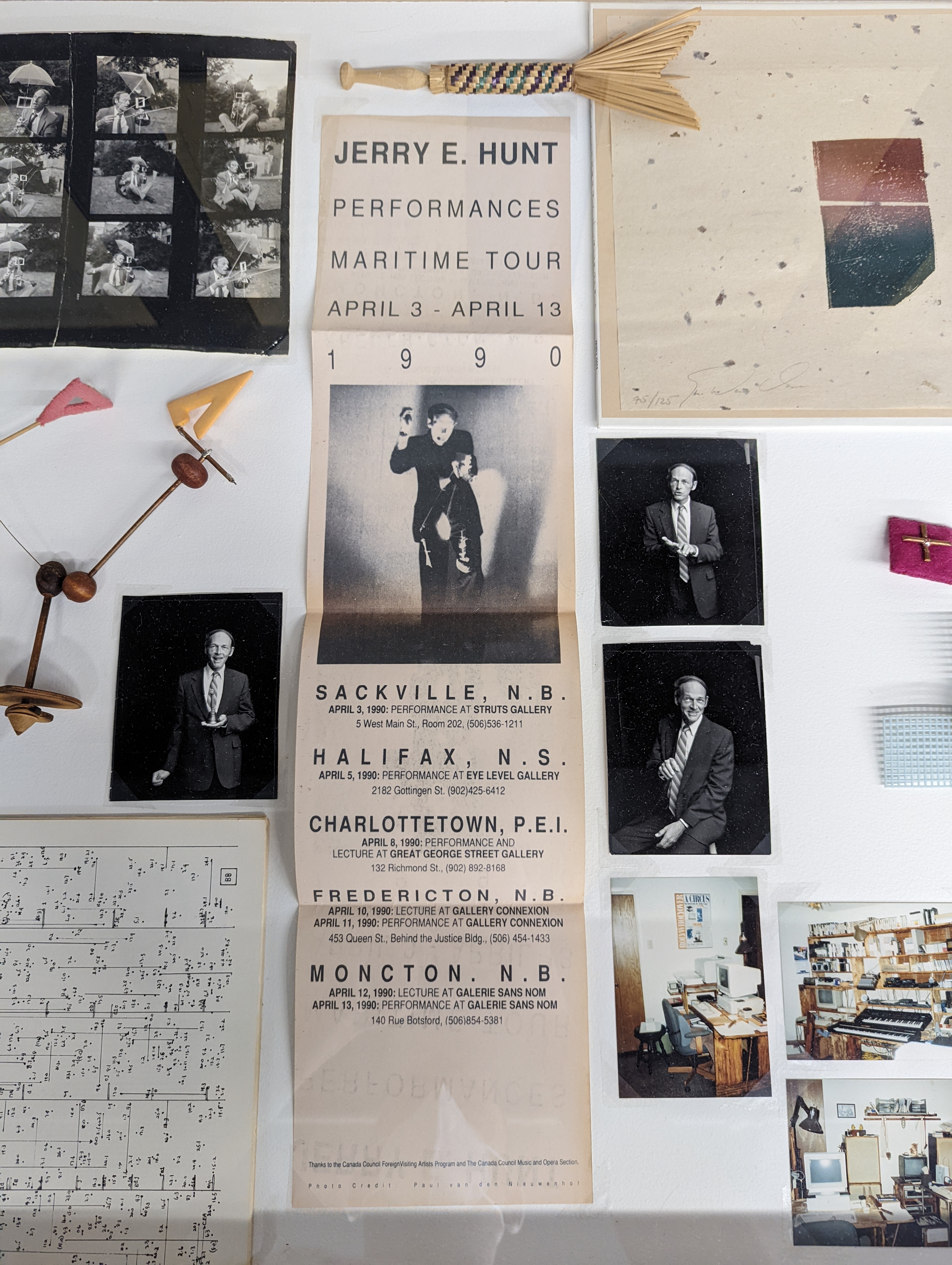 A picture from the Blank Forms exhibition showing various ephemera including scores, photographs, and a tour poster.